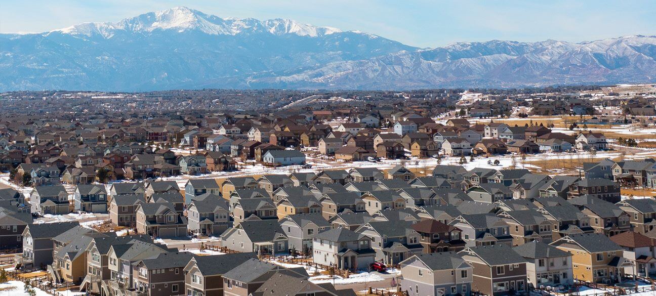 Residential neighborhood scene with Pikes Peak in the background