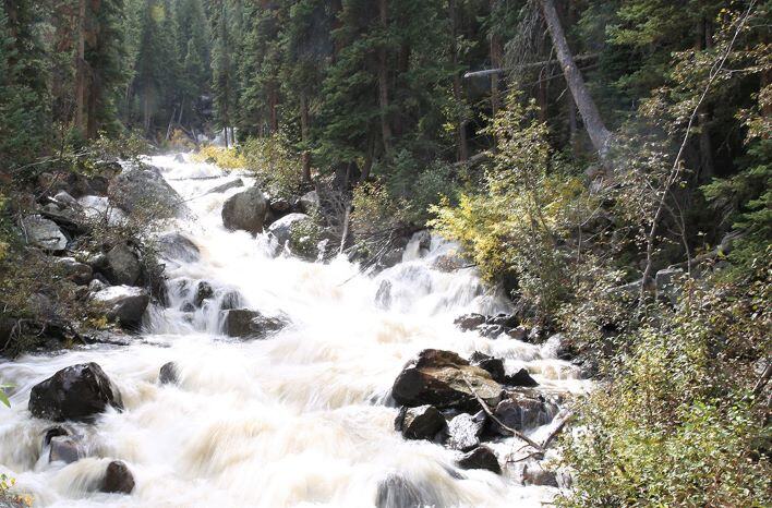 Water flowing in a river along the Homestake Collection System.