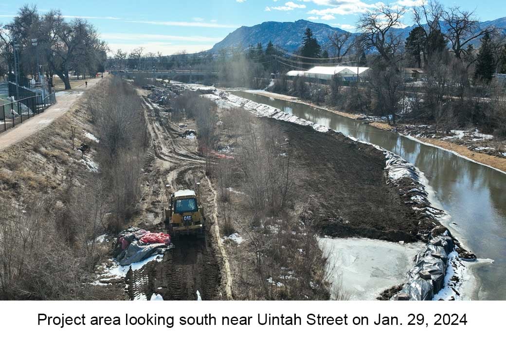 Aerial photo of Monument Creek near Uintah Street taken on January 29, 2024. A bulldozer is shown in the frame along with tracks from heavy equipment.