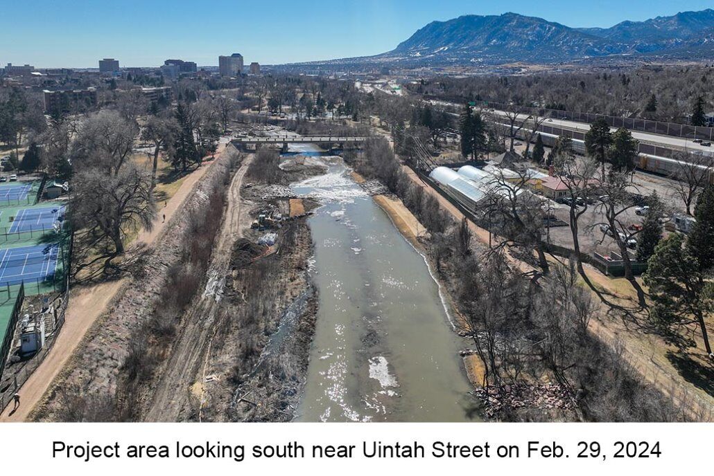 Aerial photo of Monument Creek taken on Feb. 29, 2023. An excavator is near the edge of the creek and rock structures are on both sides of the stream.